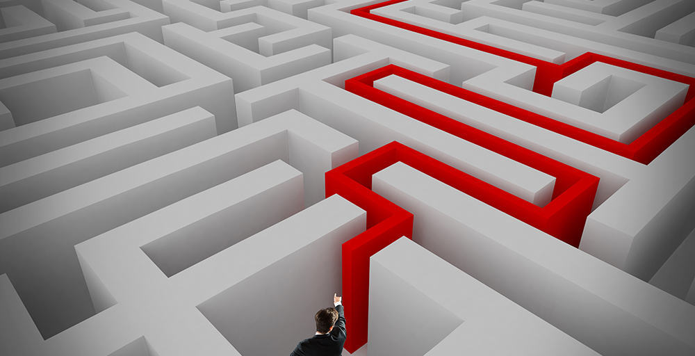 A person in a suit navigating through a complex maze, determined to find their way out.